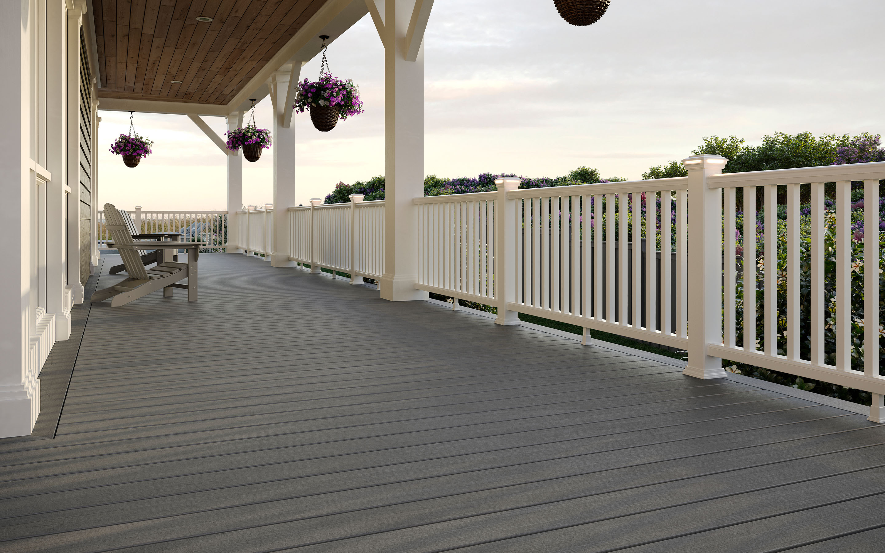 Straight-line gray Trex deck with white spindle railing — classic design in the inspiration gallery.