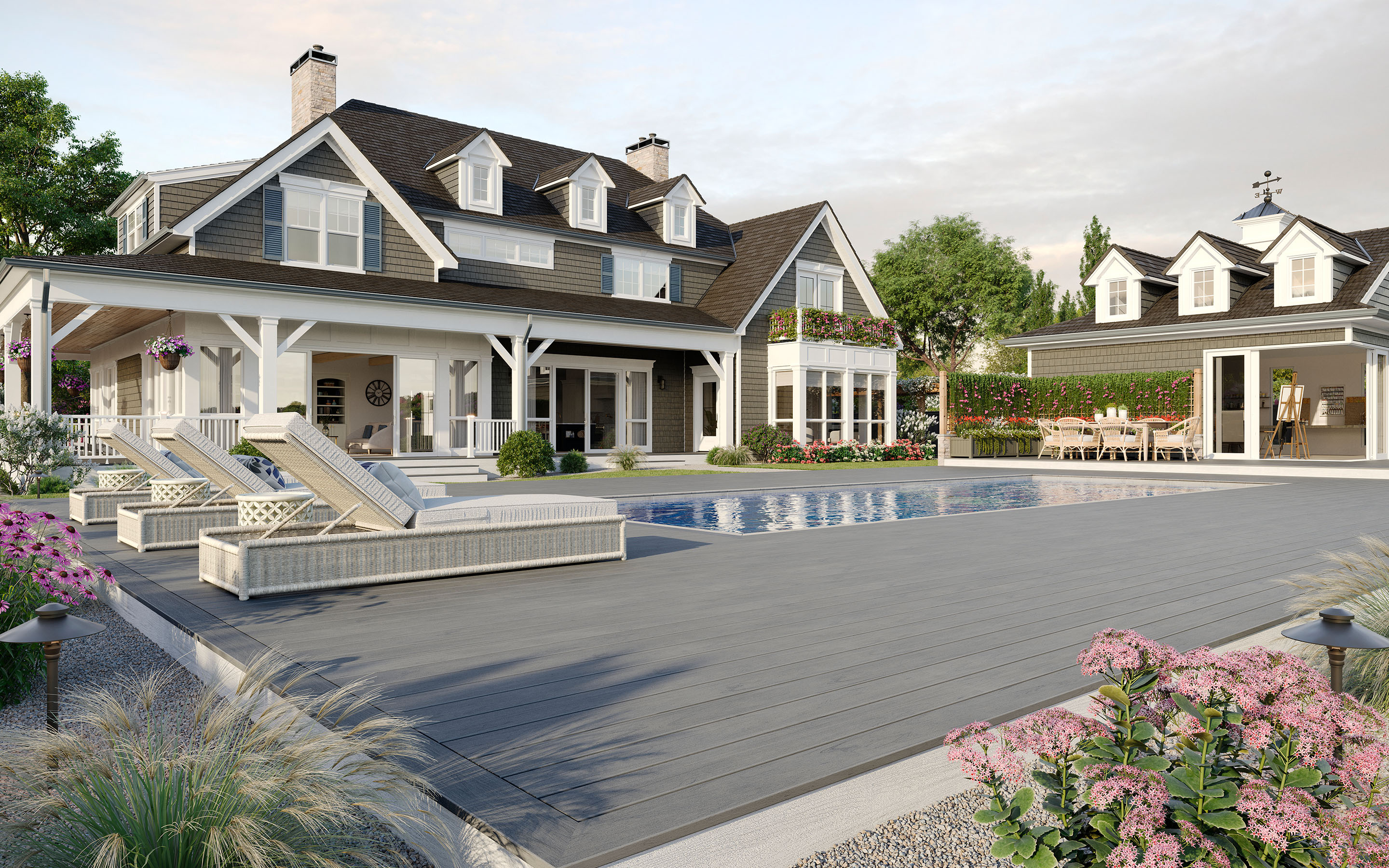 Large Trex deck surrounding a backyard pool — showcasing composite materials and wide-step layout.