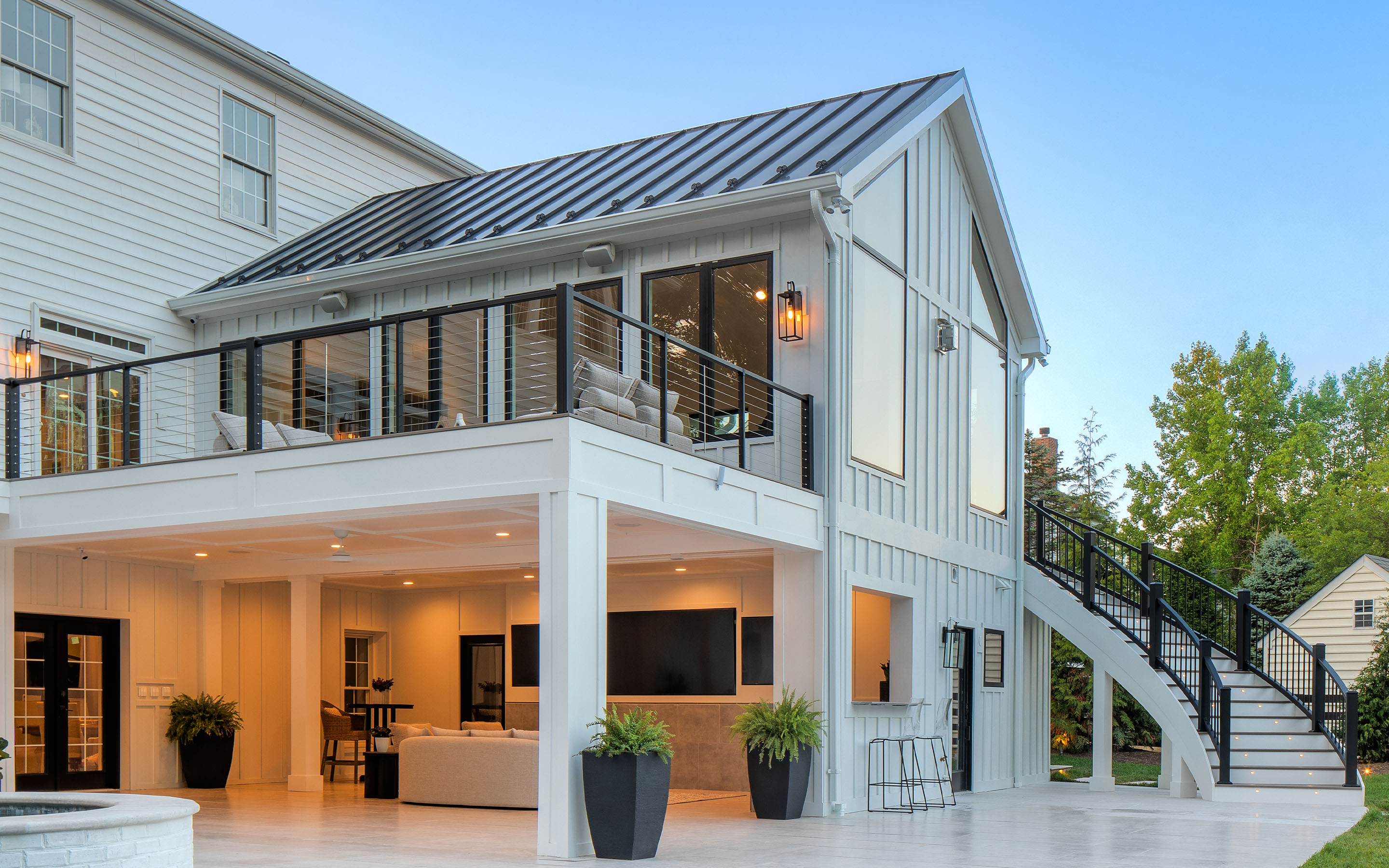 Modern two-story home with white Trex deck and black horizontal railing — inspiration from Deck One's Minneapolis Metro gallery.